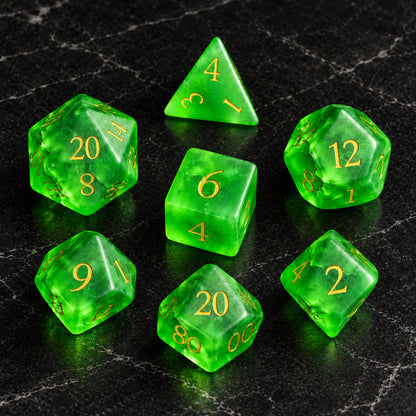 Verdant Fracture - seven-piece dice set flat lay on black marble