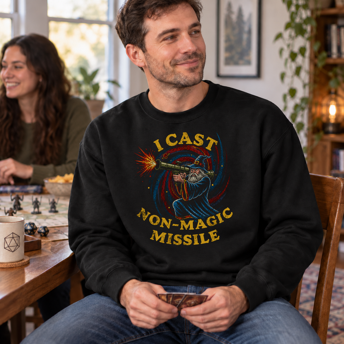 I Cast Non-Magic Missile black DnD sweatshirt worn by a man at game night