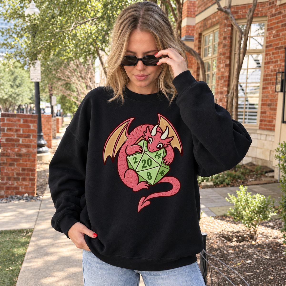 Dragon’s Lucky D20 black DnD sweatshirt worn by a woman outdoors