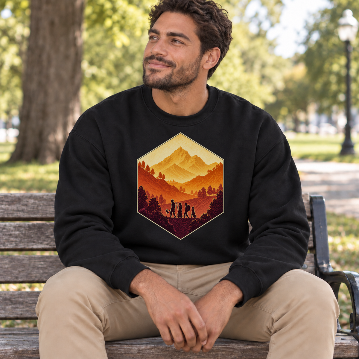 The Adventure Party black DnD sweatshirt worn by a man in a park