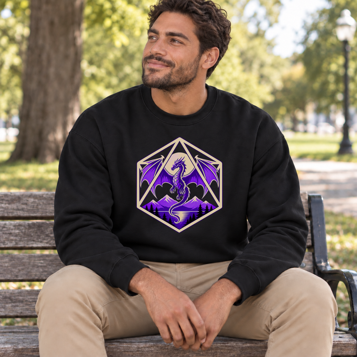 Purple Dragon D20 black DnD sweatshirt worn by a man in a park