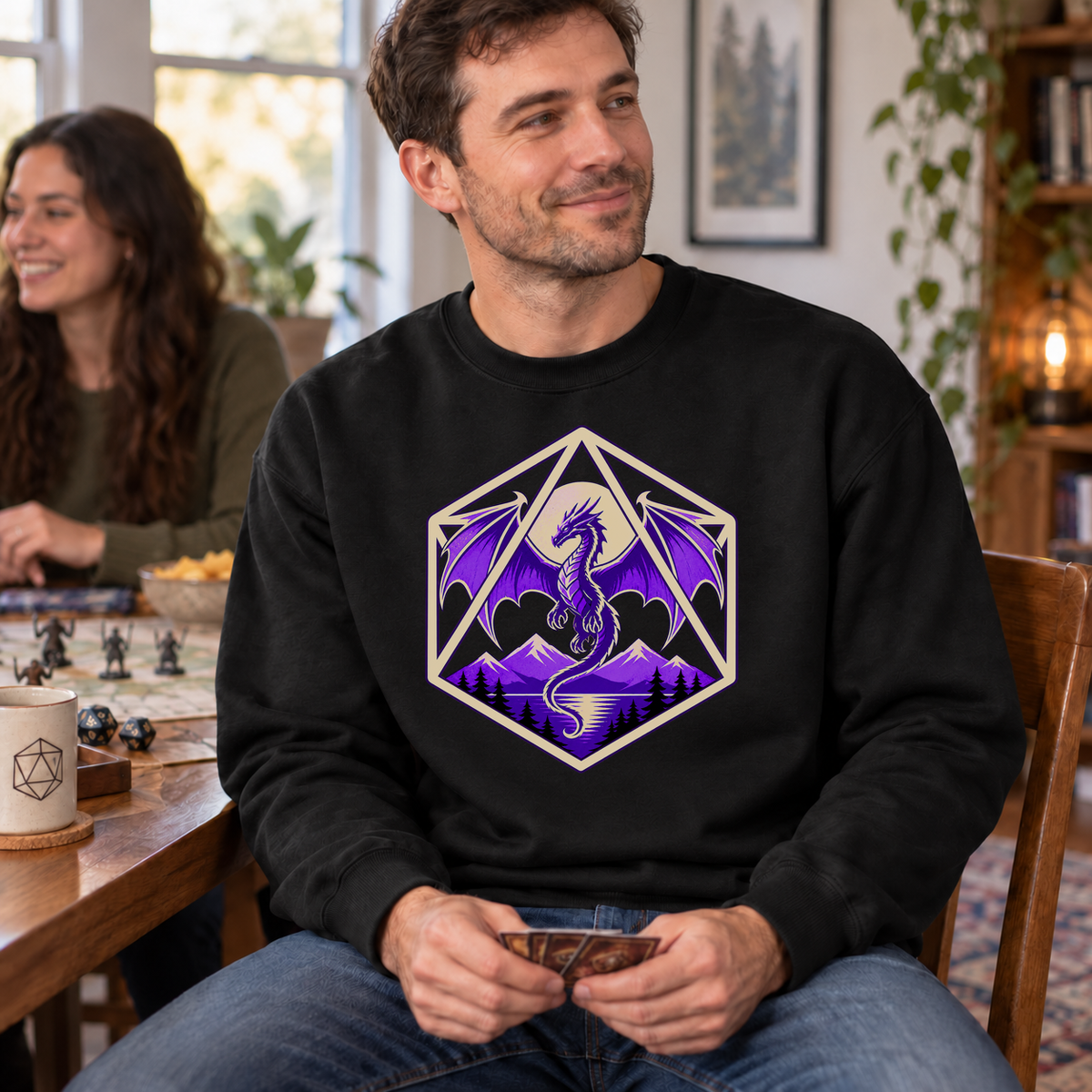 Purple Dragon D20 black DnD sweatshirt worn by a man at game night