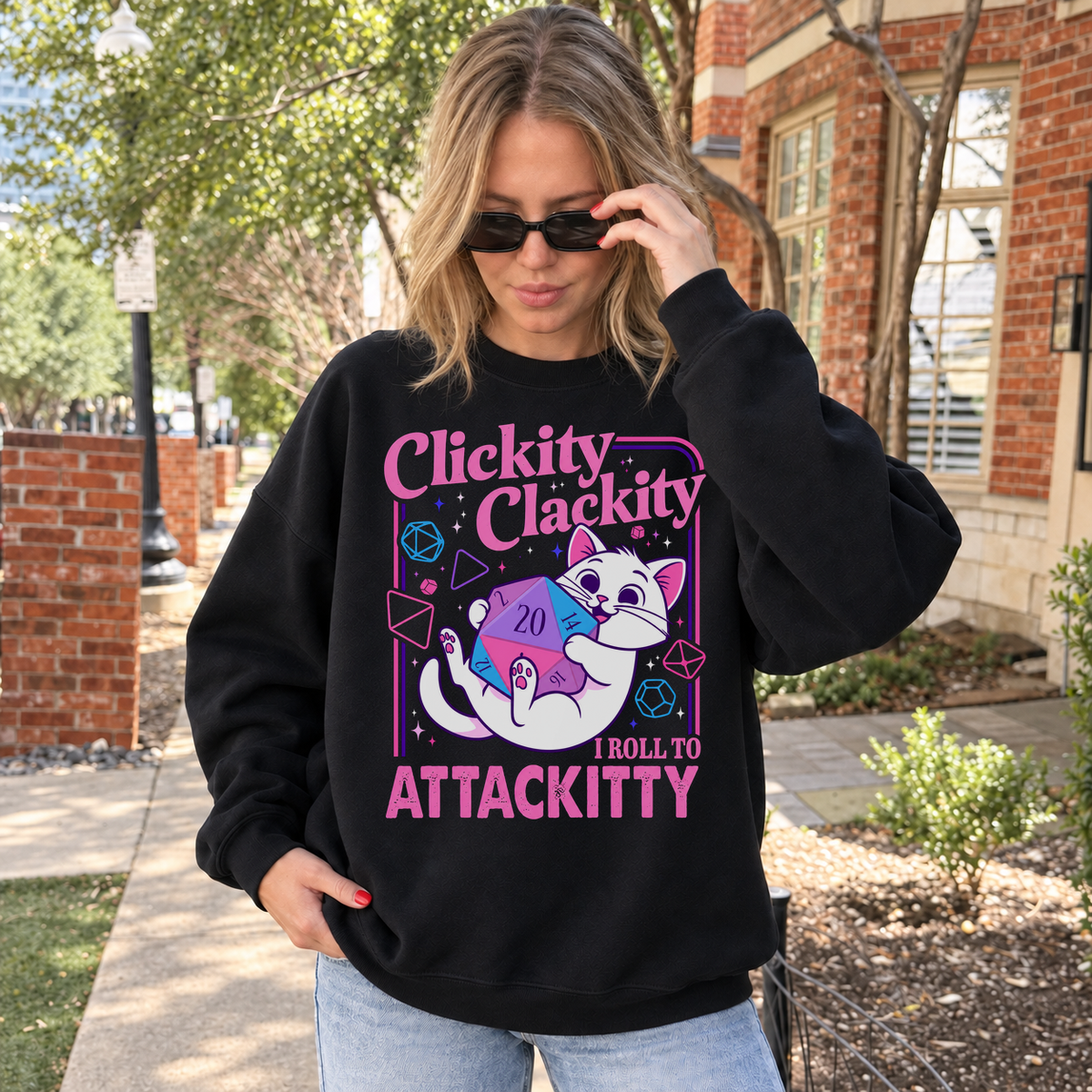 Clickity Clackity Roll to Attackity black DnD sweatshirt worn by a woman outdoors