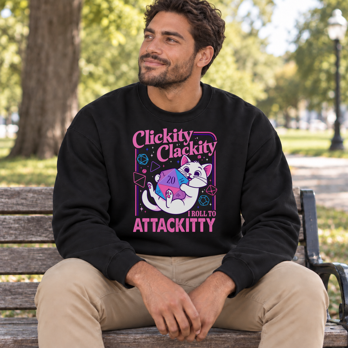 Clickity Clackity Roll to Attackity black DnD sweatshirt worn by a man in a park