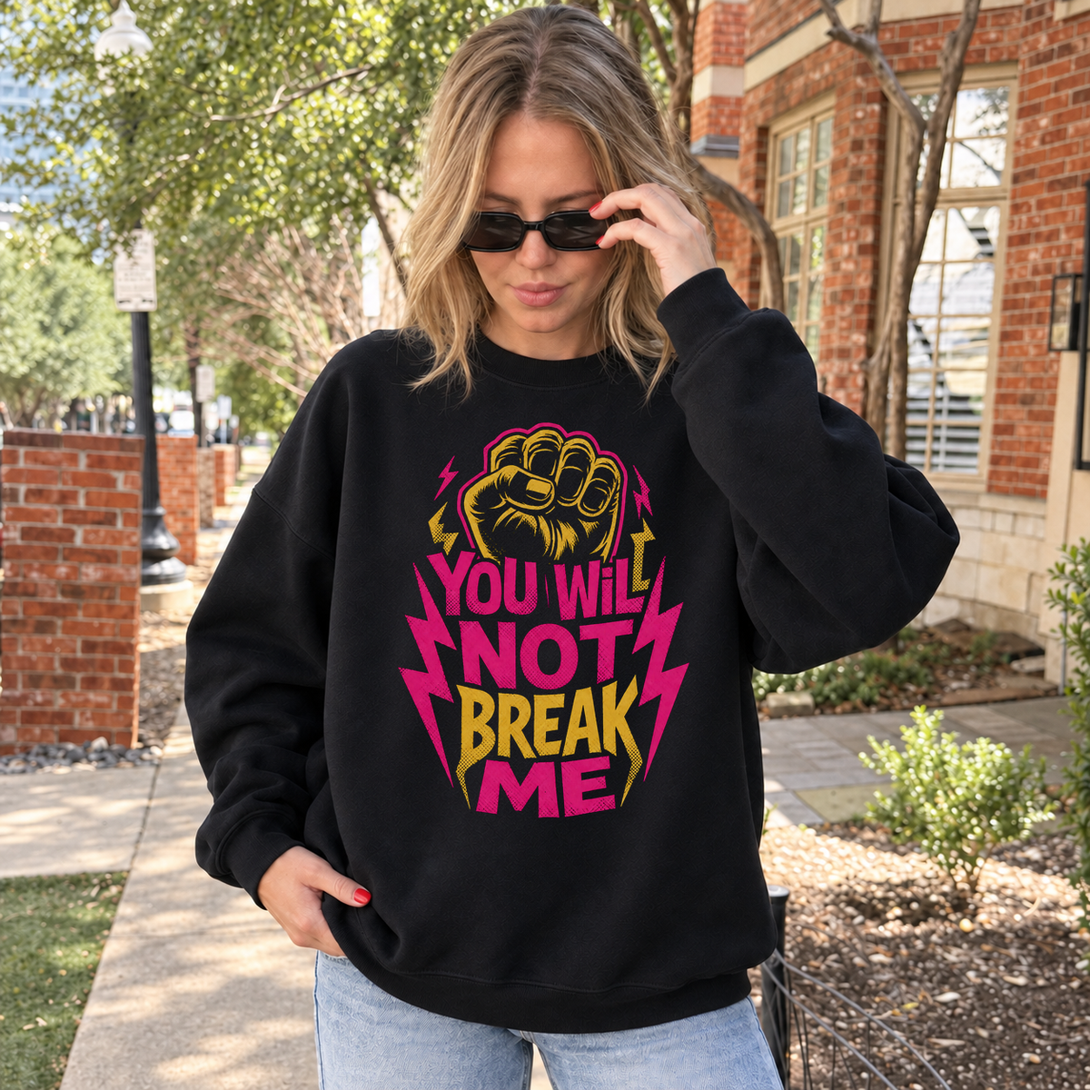 You Will Not Break Me black DnD sweatshirt worn by a woman outdoors