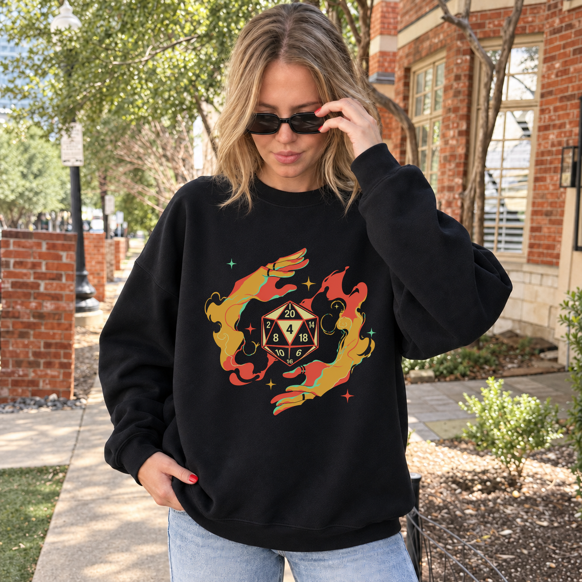 Flaming D20 black DnD sweatshirt worn by a woman outdoors
