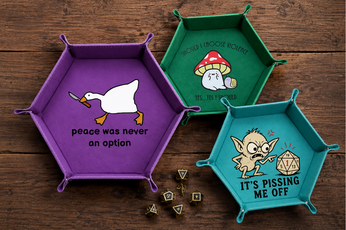 Three hexagonal wooden game boards in purple, green, and teal are arranged on a dark wood tabletop. The purple board shows a white duck illustration with the text 'peace was never an option', the green board shows a white rabbit under a red mushroom, and the teal board shows a cartoon creature with dice and the text 'IT'S PISSING ME OFF'.