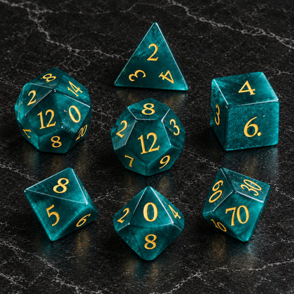 Heart of the Wildwood - seven-piece dice set flat lay on black marble