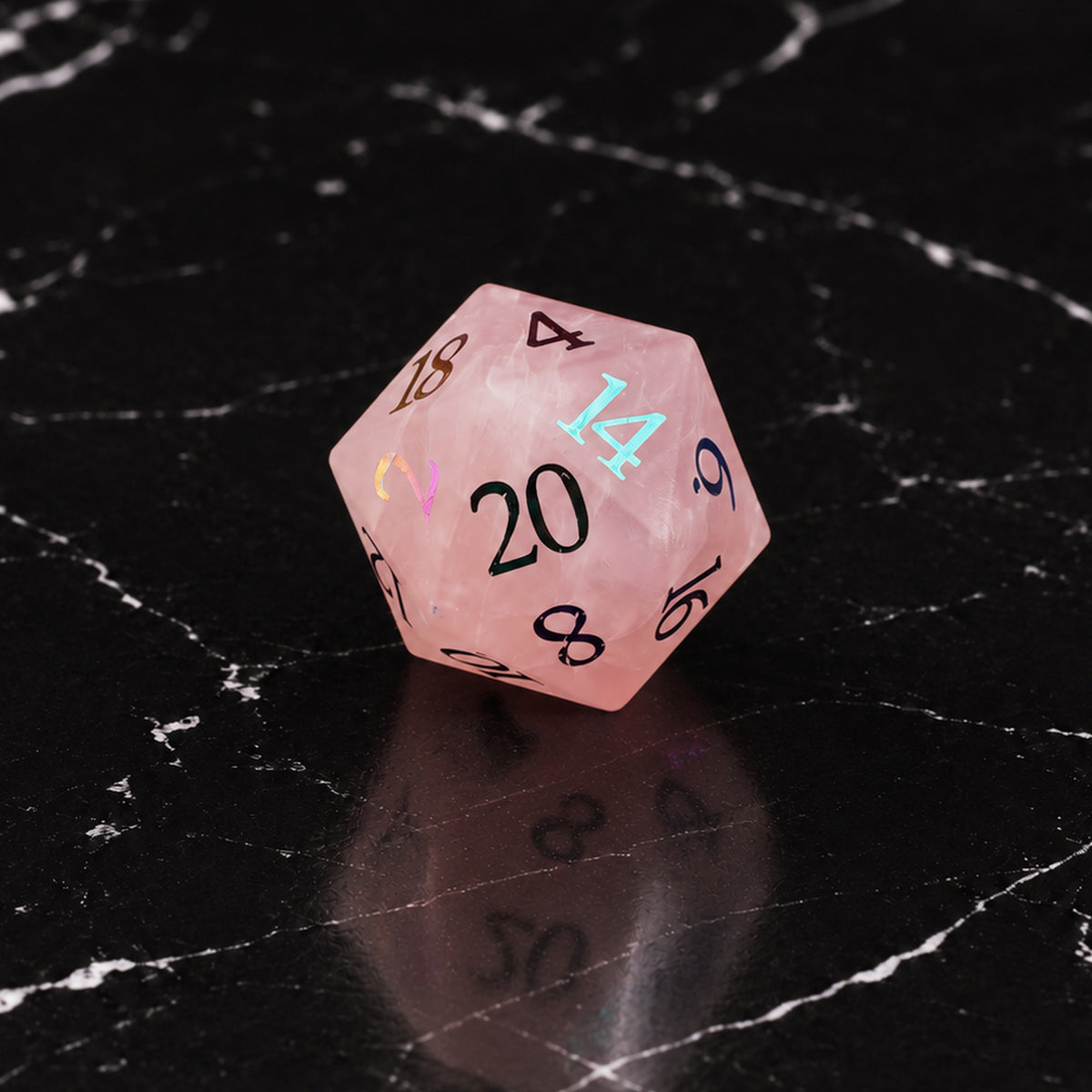 Prismrose Oracle - D20 gemstone die on black marble