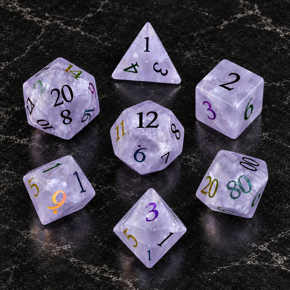 Violet Stormglass - seven-piece dice set flat lay on black marble